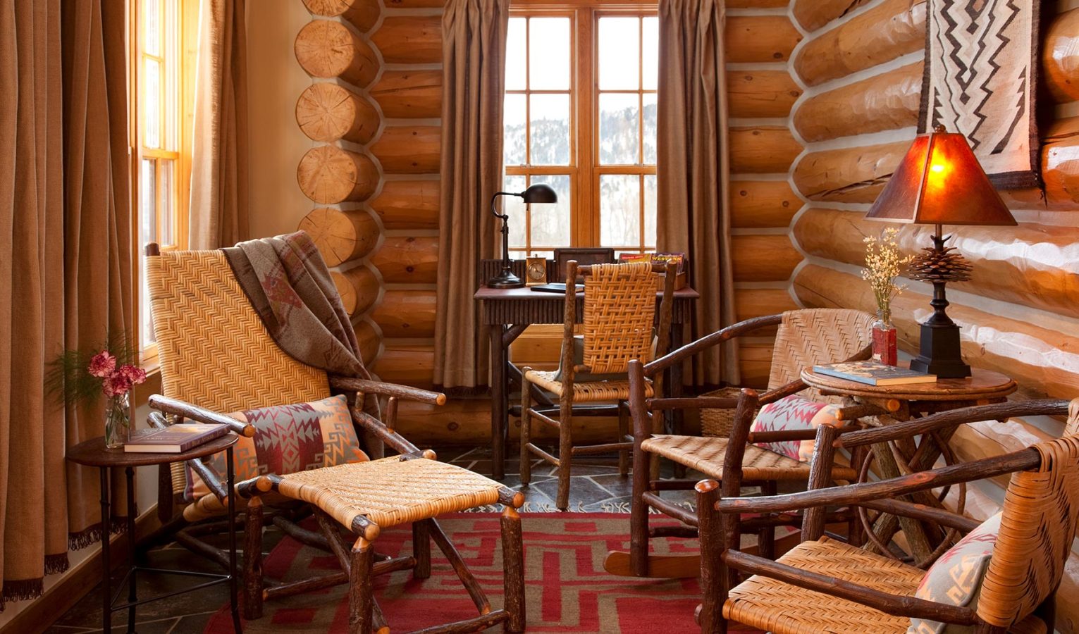 Seating area inside a wooden cabin at The Ranch At Rock Creek