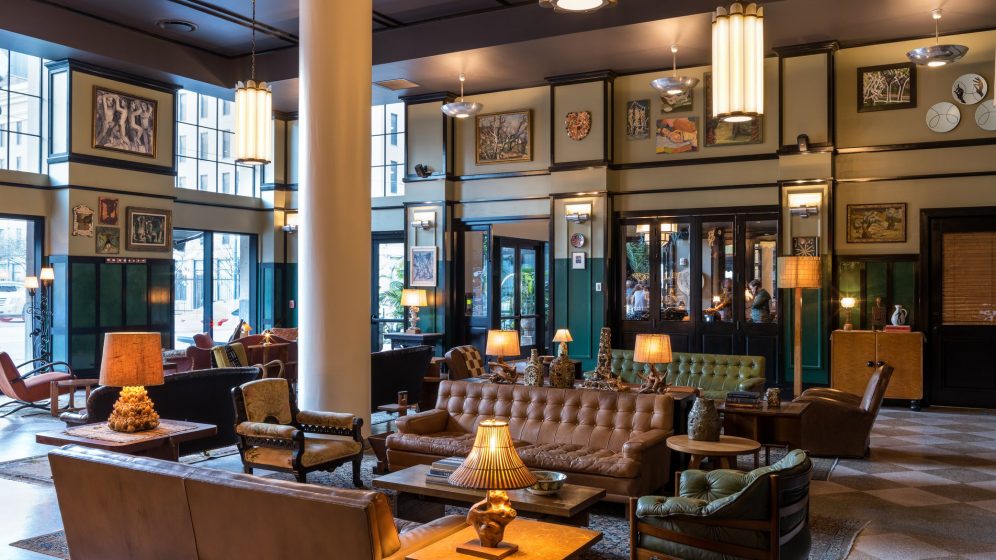 indoor lounging area with leather couches and warm lighting